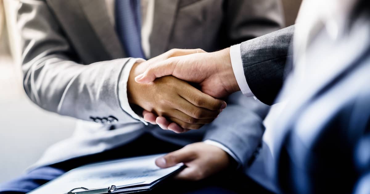 Client shaking hands with personal injury lawyer. | Patrick Daniel Law